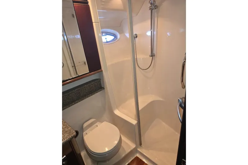  Yacht Photos Pics Bathroom interior of 2005 Sea Ray 500 Sedan Bridge yacht, featuring shower and toilet.