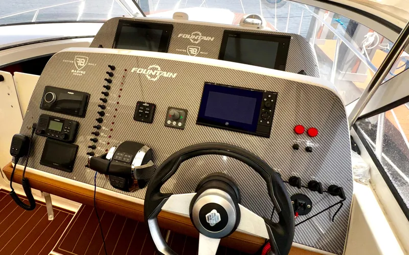  Yacht Photos Pics Control panel of a 2005 Fountain 48 Express Cruiser with navigation equipment.