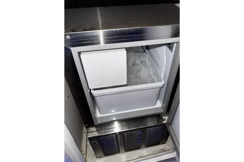  Yacht Photos Pics Ice maker inside a 2005 Fountain 48 Express Cruiser yacht, filled with ice cubes.