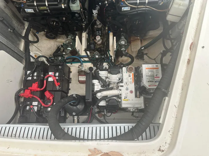  Yacht Photos Pics Engine compartment of 2012 Sea Ray 330 Sundancer with visible batteries and mechanical components.