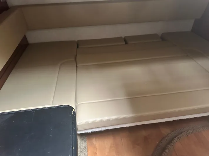  Yacht Photos Pics Interior cabin seating of 2012 Sea Ray 330 Sundancer boat, beige upholstery.