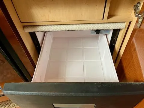  Yacht Photos Pics Open drawer in 2012 Sea Ray 330 Sundancer boat, showing empty storage compartment.