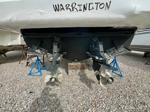  Yacht Photos Pics 2012 Sea Ray 330 Sundancer boat on stands, rear view with propellers visible.