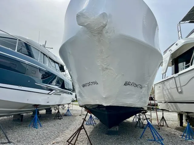  Yacht Photos Pics 2012 Sea Ray 330 Sundancer boat in storage, wrapped and elevated on stands.