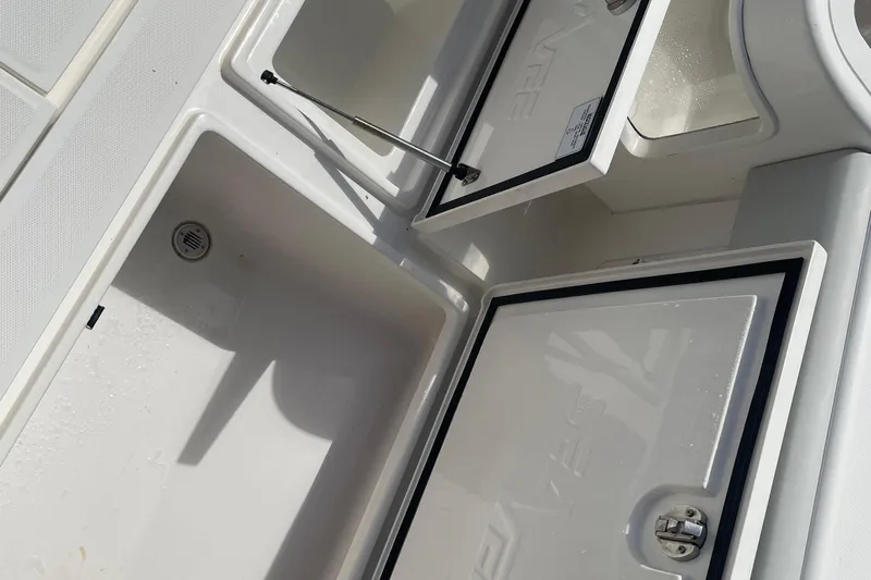  Yacht Photos Pics Open storage compartments on a 2022 SeaVee 370z boat deck.