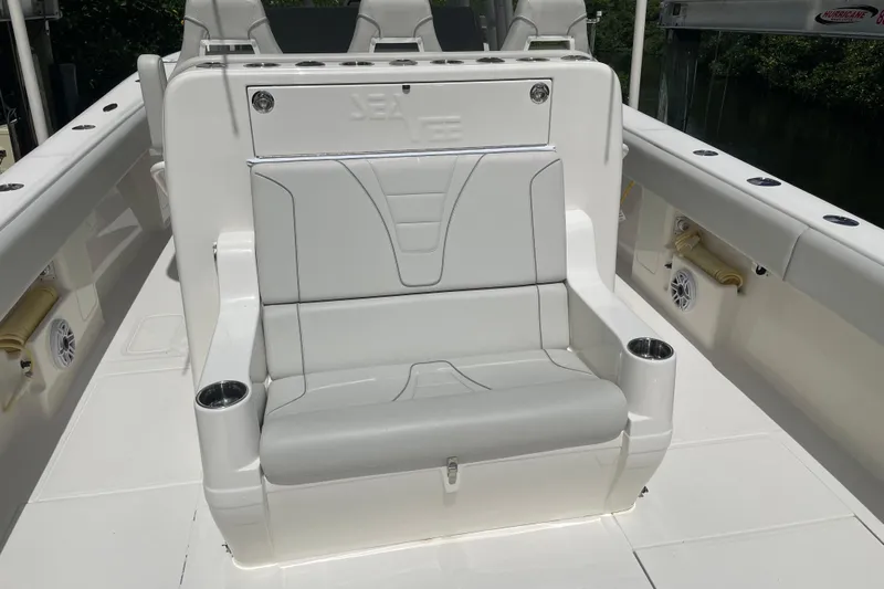  Yacht Photos Pics 2022 SeaVee 370z boat seating area with cup holders and sleek design.