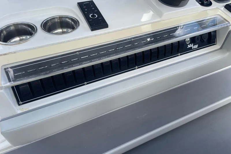  Yacht Photos Pics Control panel of 2022 SeaVee 370z boat with switches and cup holders.