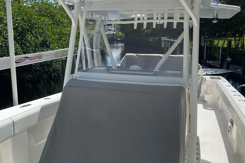  Yacht Photos Pics 2022 SeaVee 370z boat with sleek design, docked near lush greenery.
