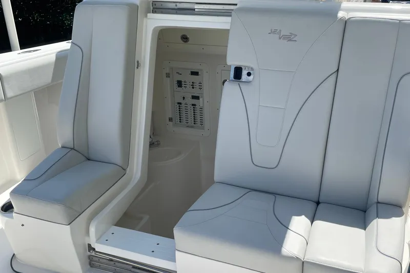  Yacht Photos Pics 2022 SeaVee 370z boat interior with white seating and control panel.