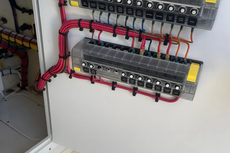  Yacht Photos Pics Electrical panel with labeled switches and wiring on a 2022 SeaVee 370z boat.