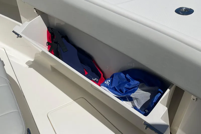  Yacht Photos Pics Storage compartment on 2022 SeaVee 370z boat with life jackets and gear.