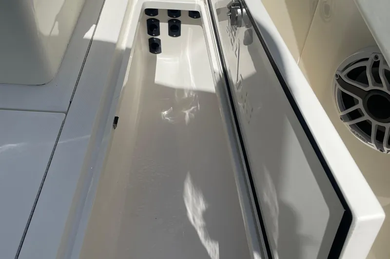  Yacht Photos Pics Open storage compartment on 2022 SeaVee 370z boat, featuring sleek design and speaker.