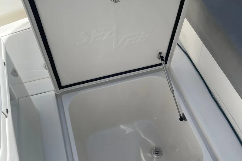  Yacht Photos Pics Open storage compartment on 2022 SeaVee 370z boat, featuring hydraulic support.