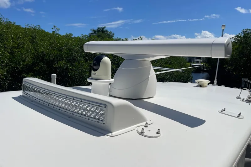  Yacht Photos Pics 2022 SeaVee 370z boat radar and camera system on deck under clear blue sky.