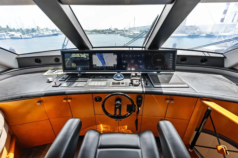 Voyager Yacht Photos Pics 2006 Lazzara Skylounge yacht helm with advanced navigation systems and luxurious interior design.