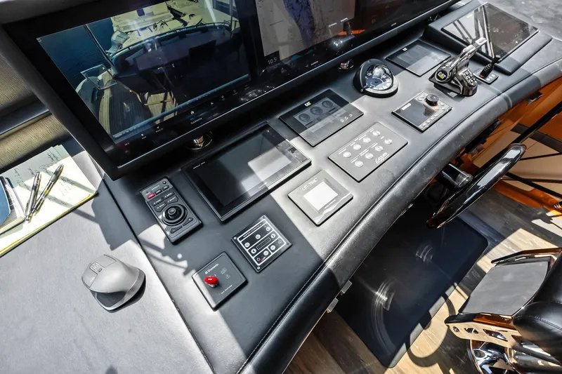 Voyager Yacht Photos Pics Control panel of a 2006 Lazzara Skylounge yacht with advanced navigation equipment.