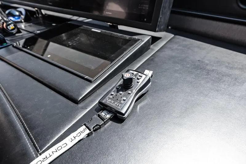 Voyager Yacht Photos Pics Control panel of 2006 Lazzara Skylounge yacht with joystick and touchscreen display.