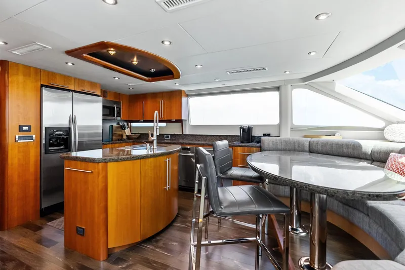 Voyager Yacht Photos Pics Luxurious 2006 Lazzara Skylounge yacht interior with modern kitchen and dining area.
