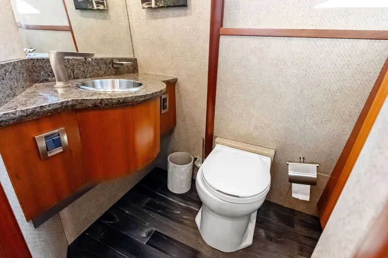 Voyager Yacht Photos Pics Luxurious bathroom in 2006 Lazzara Skylounge yacht with modern fixtures and elegant design.