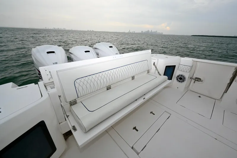  Yacht Photos Pics 2021 Intrepid 438 Evolution boat with spacious deck and powerful engines on open water.