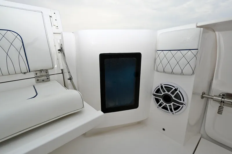 Yacht Photos Pics Interior view of 2021 Intrepid 438 Evolution boat, featuring seating and speaker system.