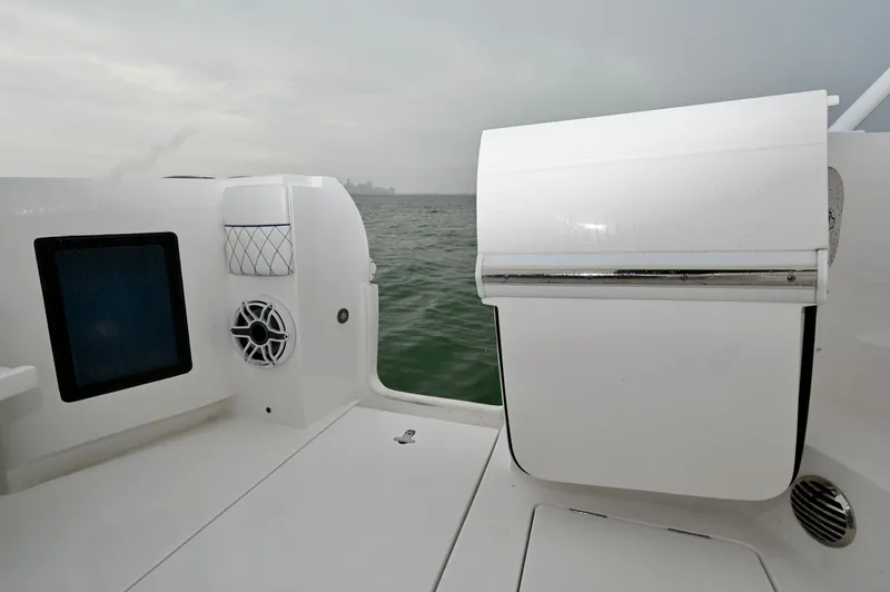  Yacht Photos Pics 2021 Intrepid 438 Evolution boat interior with speaker and storage compartment.
