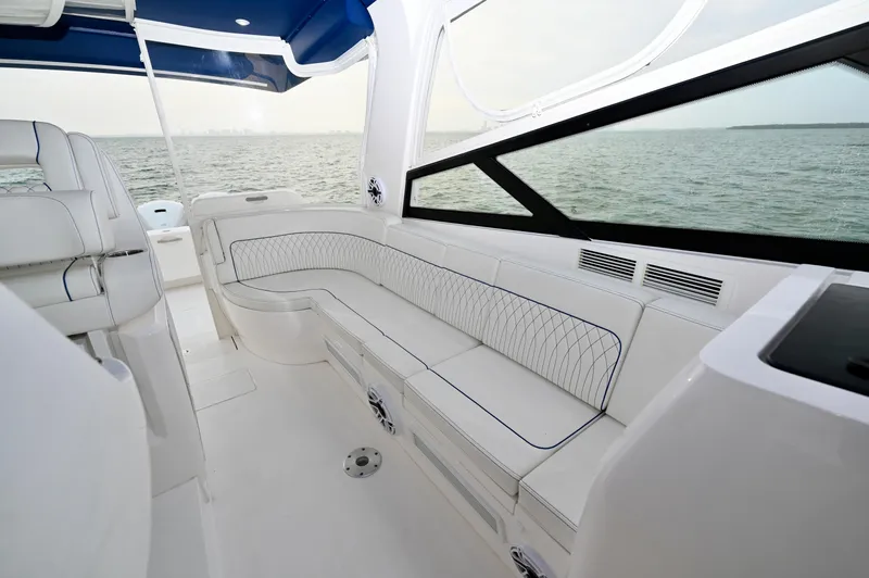  Yacht Photos Pics 2021 Intrepid 438 Evolution yacht interior with sleek seating and ocean view.
