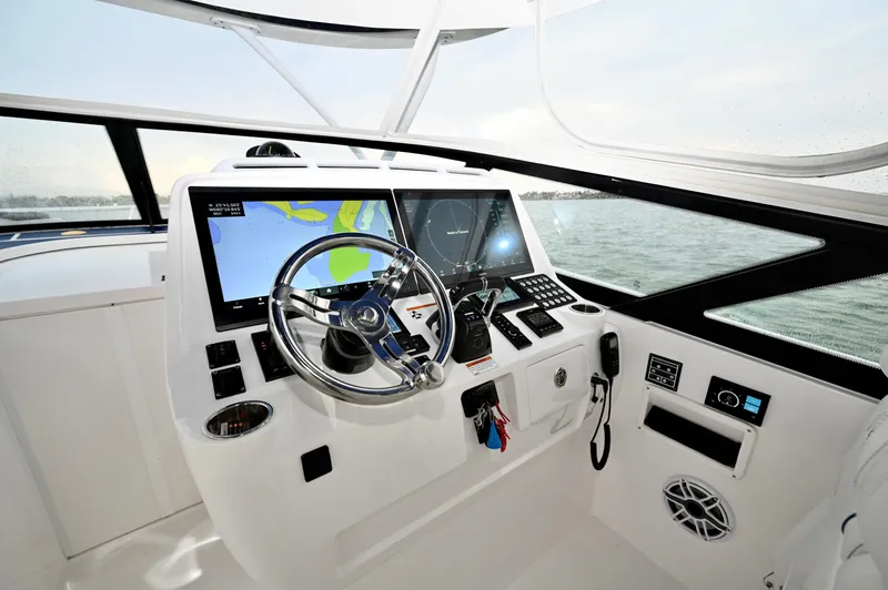  Yacht Photos Pics Helm of 2021 Intrepid 438 Evolution boat with advanced navigation systems.