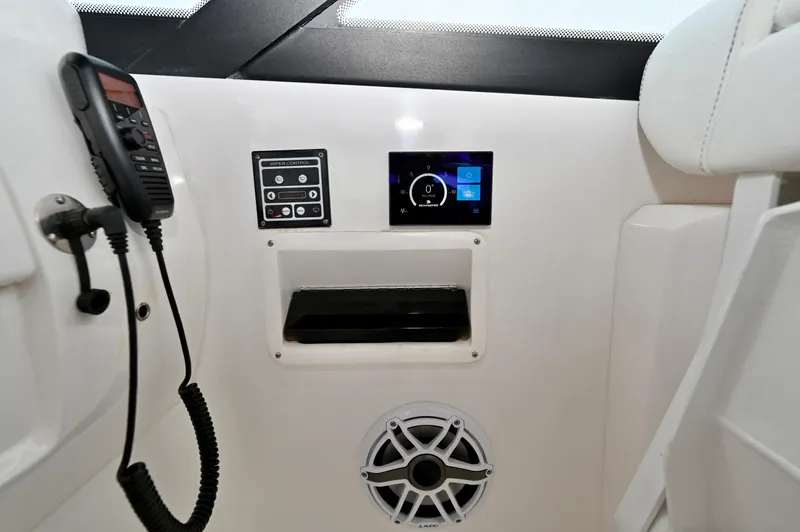  Yacht Photos Pics Control panel of 2021 Intrepid 438 Evolution boat with radio and speaker.