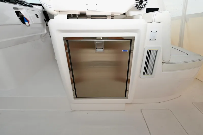  Yacht Photos Pics 2021 Intrepid 438 Evolution boat interior with stainless steel refrigerator.