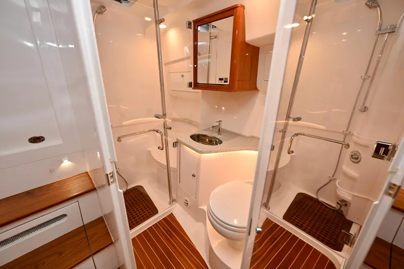  Yacht Photos Pics Luxurious bathroom interior of 2021 Intrepid 438 Evolution yacht with modern fixtures.