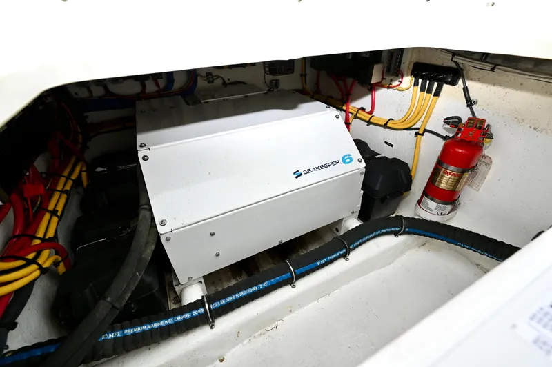  Yacht Photos Pics Engine compartment of 2021 Intrepid 438 Evolution with Seakeeper 6 and fire extinguisher.