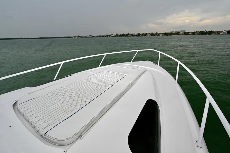  Yacht Photos Pics Bow view of 2021 Intrepid 438 Evolution yacht on calm waters.