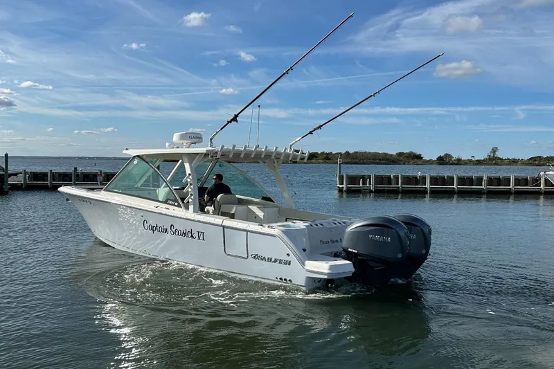  Yacht Photos Pics 2023 Sailfish 316 DC boat on water with dual Yamaha engines, clear sky background.