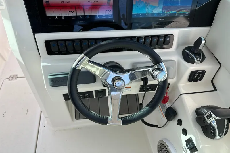  Yacht Photos Pics Steering console of 2023 Sailfish 316 DC boat with modern controls and displays.