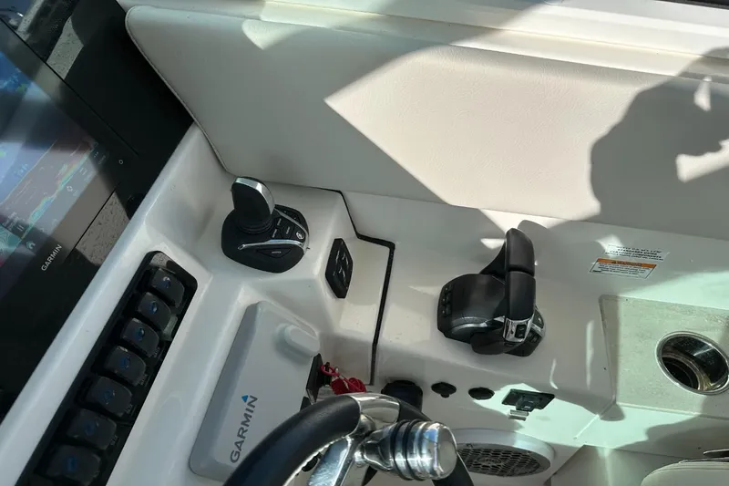  Yacht Photos Pics 2023 Sailfish 316 DC boat dashboard with Garmin controls and joystick.