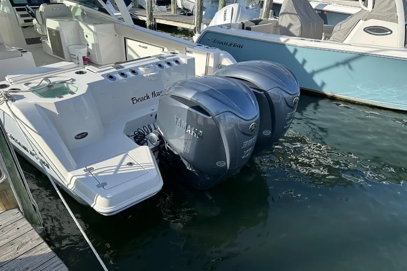  Yacht Photos Pics 2023 Sailfish 316 DC boat with twin Yamaha outboard engines docked at marina.