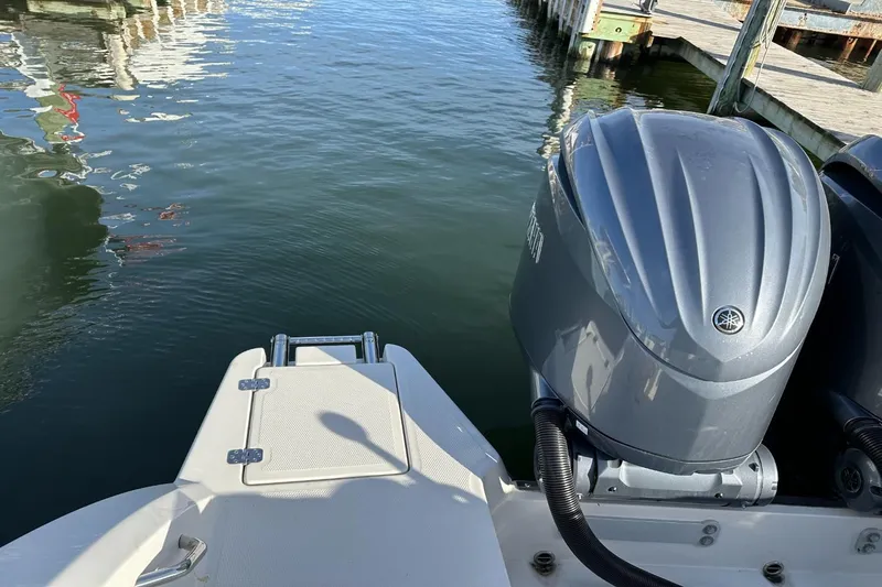  Yacht Photos Pics 2023 Sailfish 316 DC boat with Yamaha outboard engine at dockside.