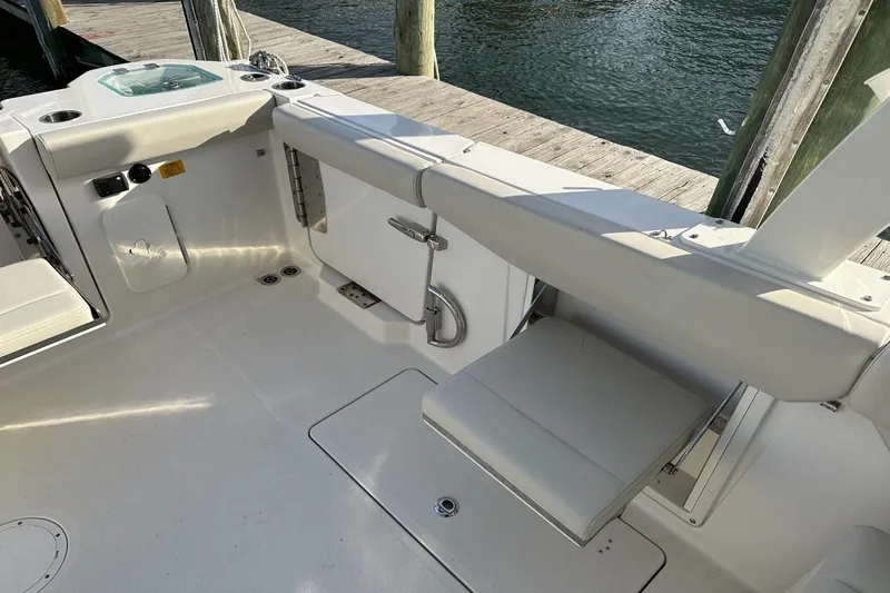  Yacht Photos Pics 2023 Sailfish 316 DC boat interior with seating and dock view.