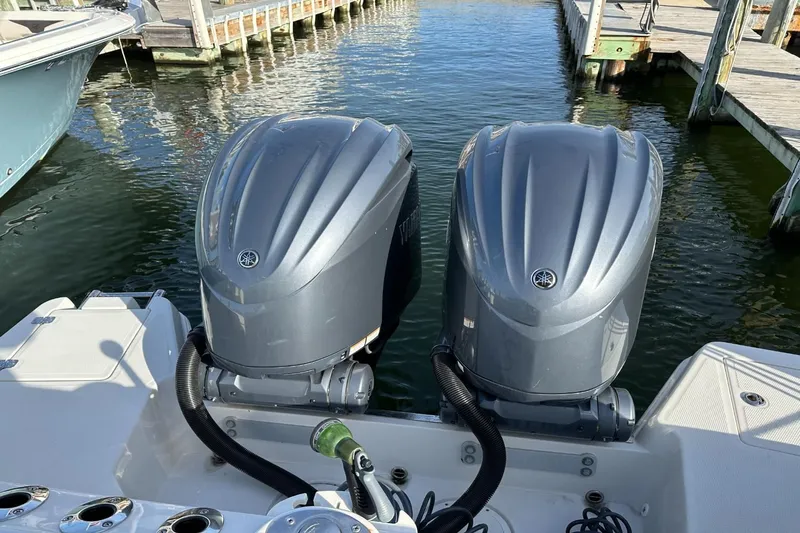  Yacht Photos Pics Twin Yamaha outboard engines on a 2023 Sailfish 316 DC boat at a marina.