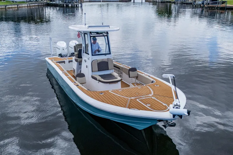  Yacht Photos Pics 2023 Tidewater 2700 Carolina Bay boat on calm water, featuring sleek design and modern amenities.