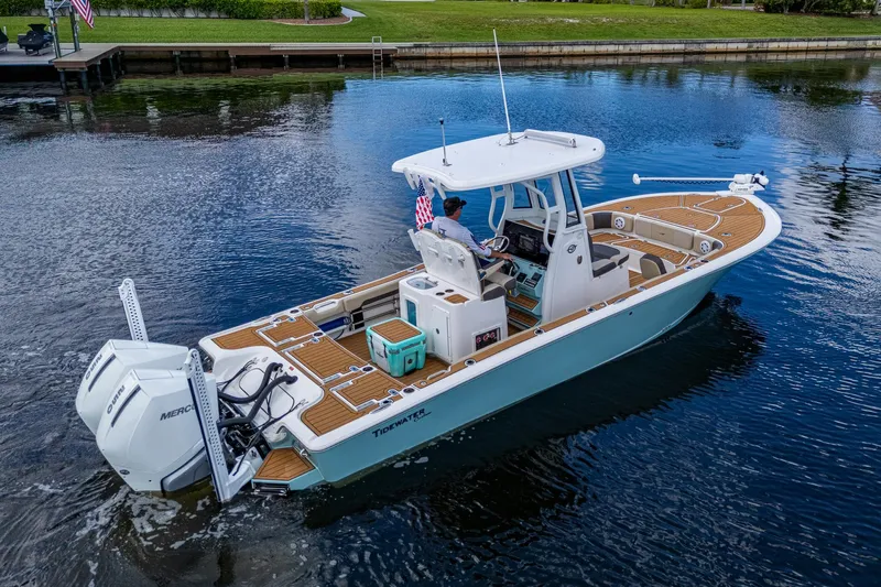  Yacht Photos Pics 2023 Tidewater 2700 Carolina Bay boat cruising on a calm waterway.