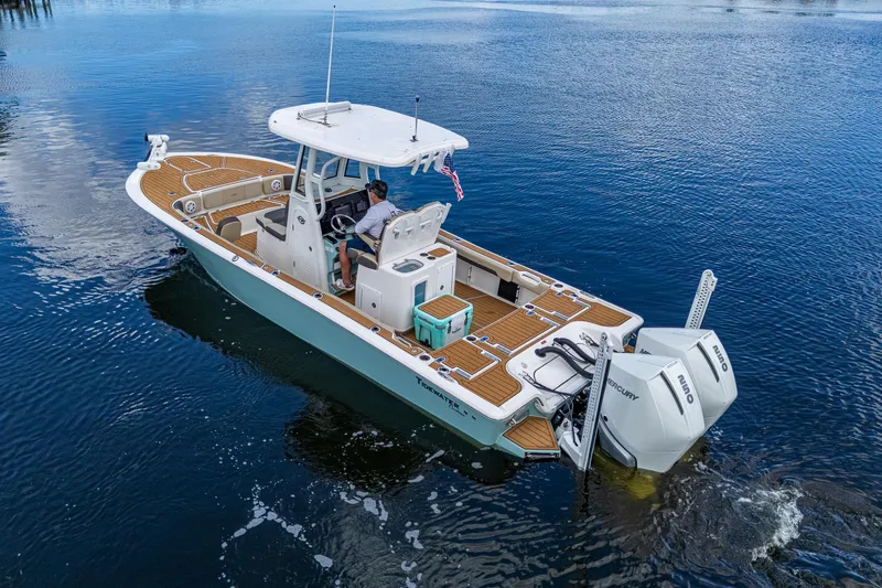  Yacht Photos Pics 2023 Tidewater 2700 Carolina Bay boat cruising on calm water.