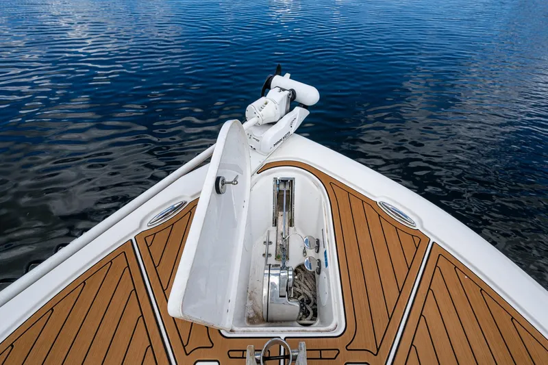  Yacht Photos Pics Bow of 2023 Tidewater 2700 Carolina Bay boat on calm water.