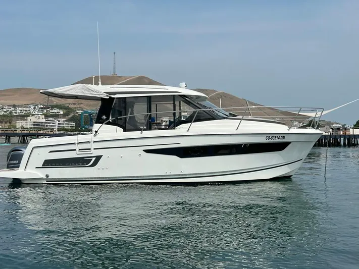Marea Yacht Photos Pics 2019 Jeanneau Merry Fisher 895 boat on calm water, side view.