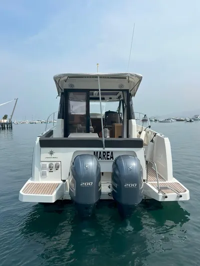 Marea Yacht Photos Pics 2019 Jeanneau Merry Fisher 895 boat with twin 200 HP engines on calm water.