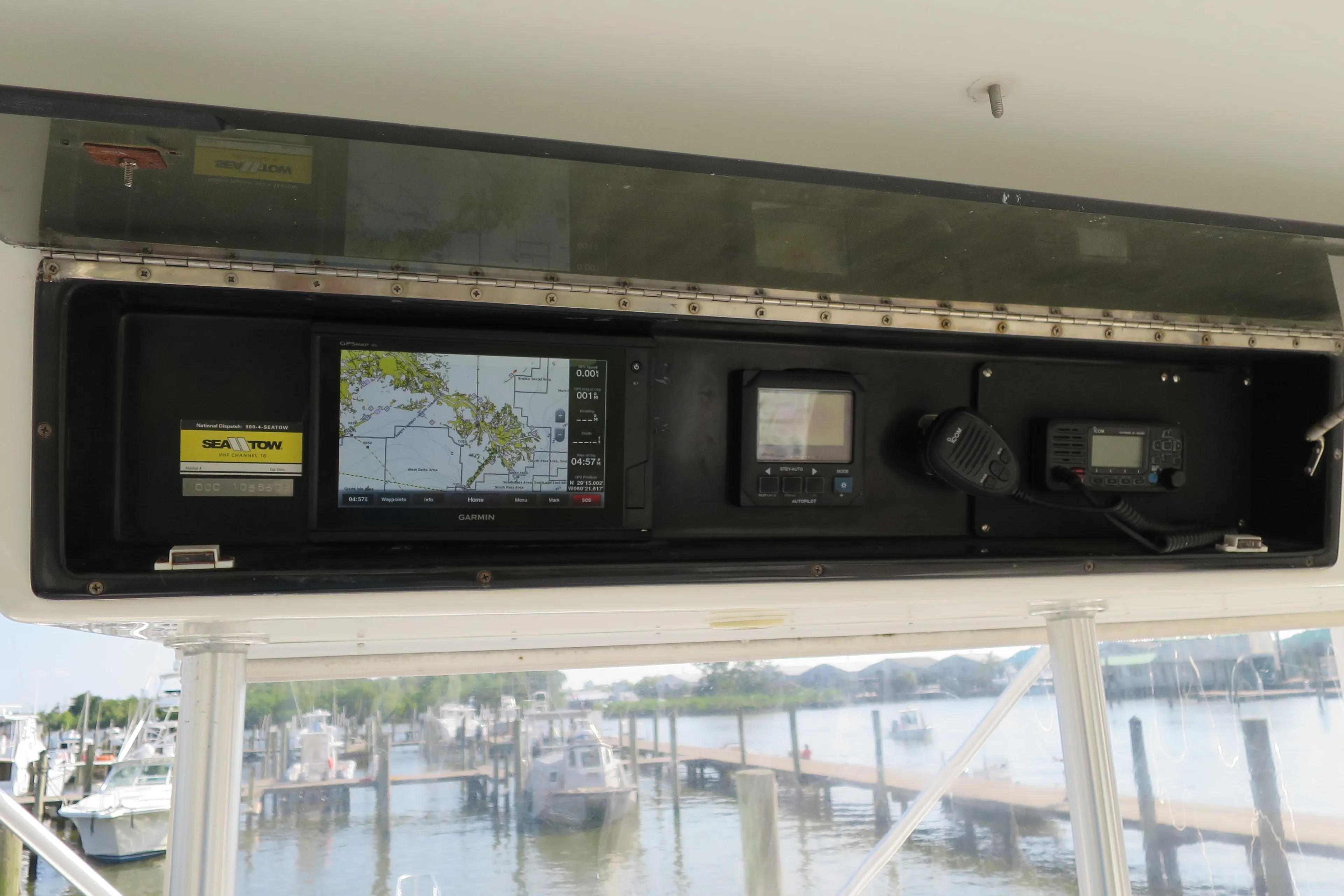 Navigation equipment on 1997 Post 50 Flybridge yacht, docked at marina.