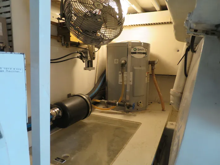 High Risk Yacht Photos Pics Engine room of a 1997 Post 50 Flybridge yacht with water heater and fan.