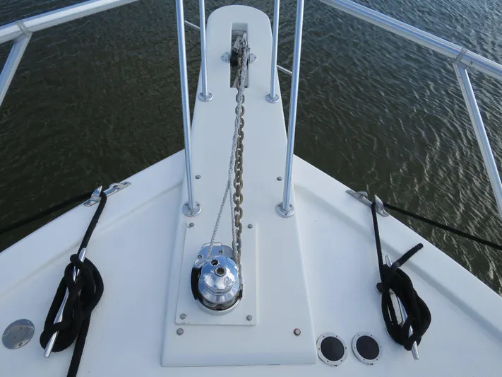High Risk Yacht Photos Pics Bow of 1997 Post 50 Flybridge yacht with anchor chain and winch.