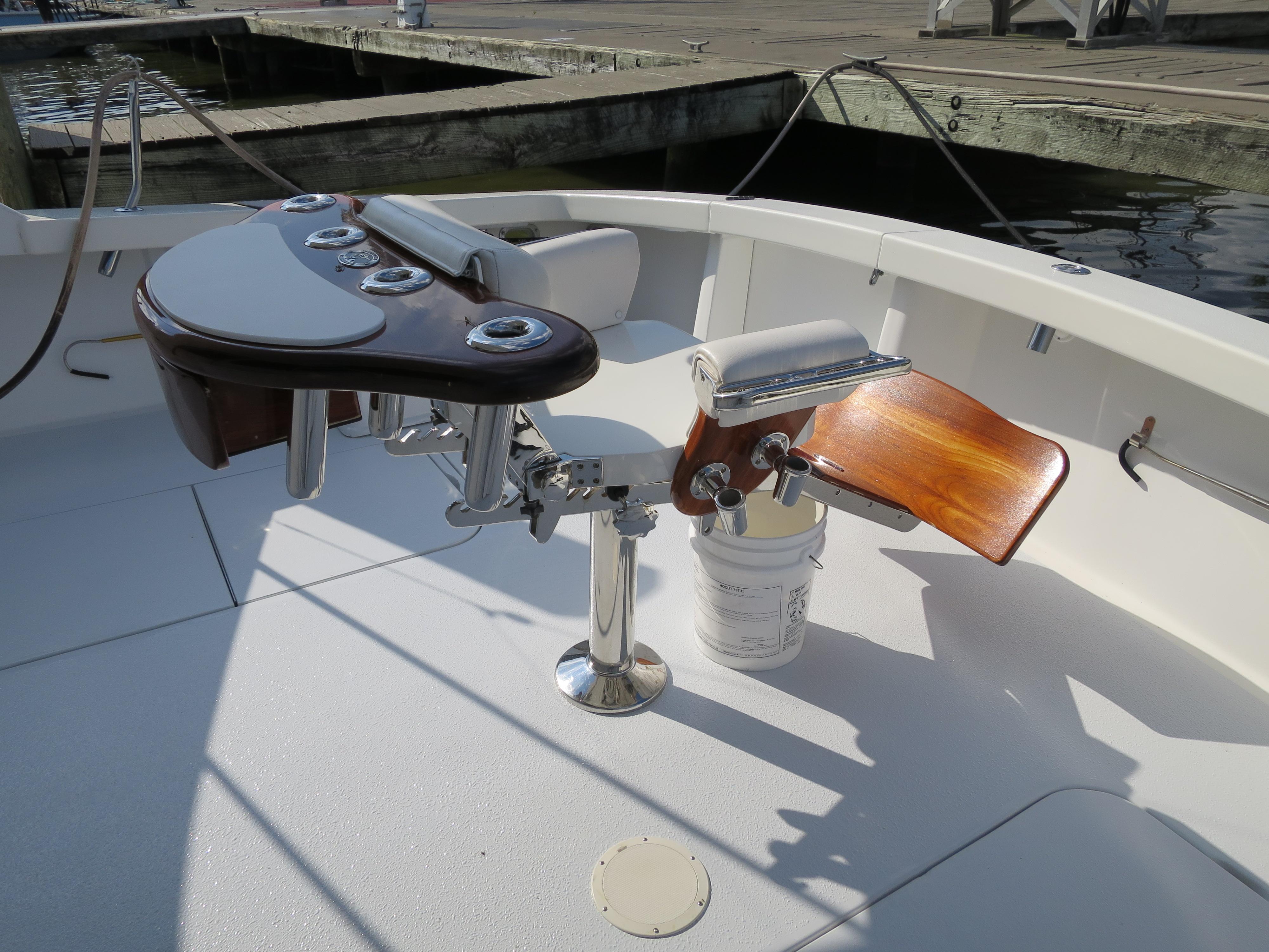 1997 Post 50 Flybridge fishing chair and rod holders on deck.